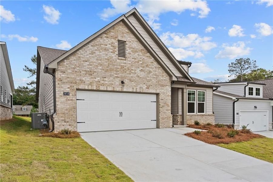 Front exterior of a new home in Kelly Preserve, Loganville, GA, highlighting curb appeal (Image 5).
