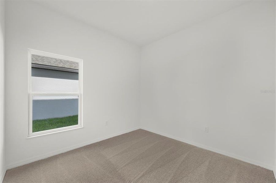 Spacious, unfurnished interior of a new home in Peach Crossings, Winter Haven (Image 24).