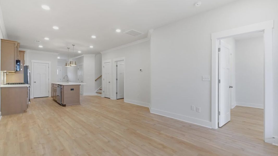 Hardwood flooring and high standards define this vibrant family room ideal for everyday living in Greenville, SC
