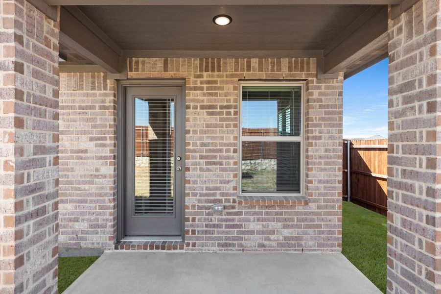 Front exterior of a new home in Northspur, Terrell, TX, highlighting curb appeal (Image 28). Front exterior of a new home in Northspur, Terrell, TX, highlighting curb appeal (Image 28).