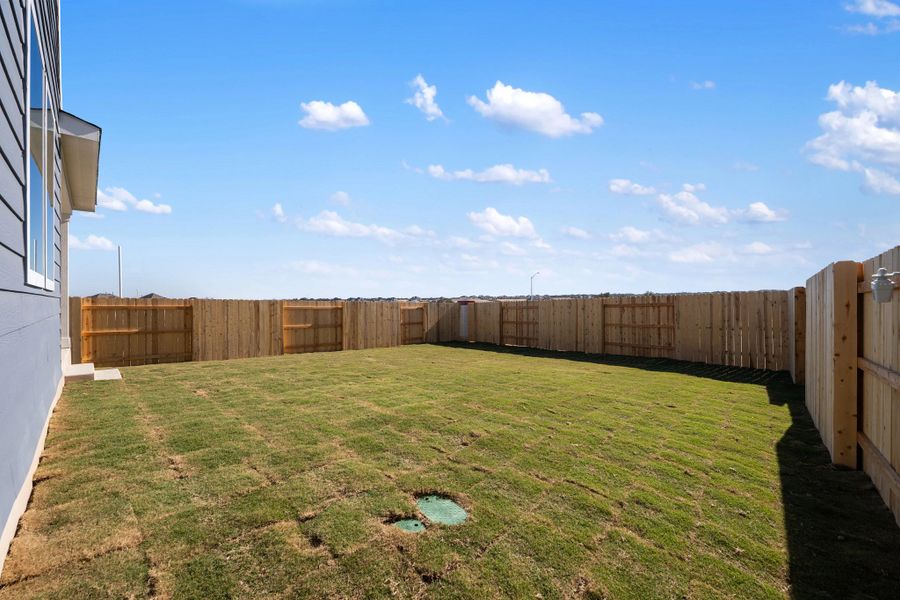 Exterior details and patio area of a home in The Homestead at Lariat, Liberty Hill (Image 34).