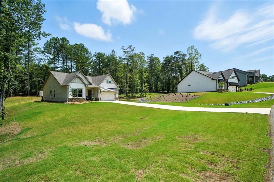 Front exterior of a new home in , Ellijay, GA, highlighting curb appeal (Image 24).