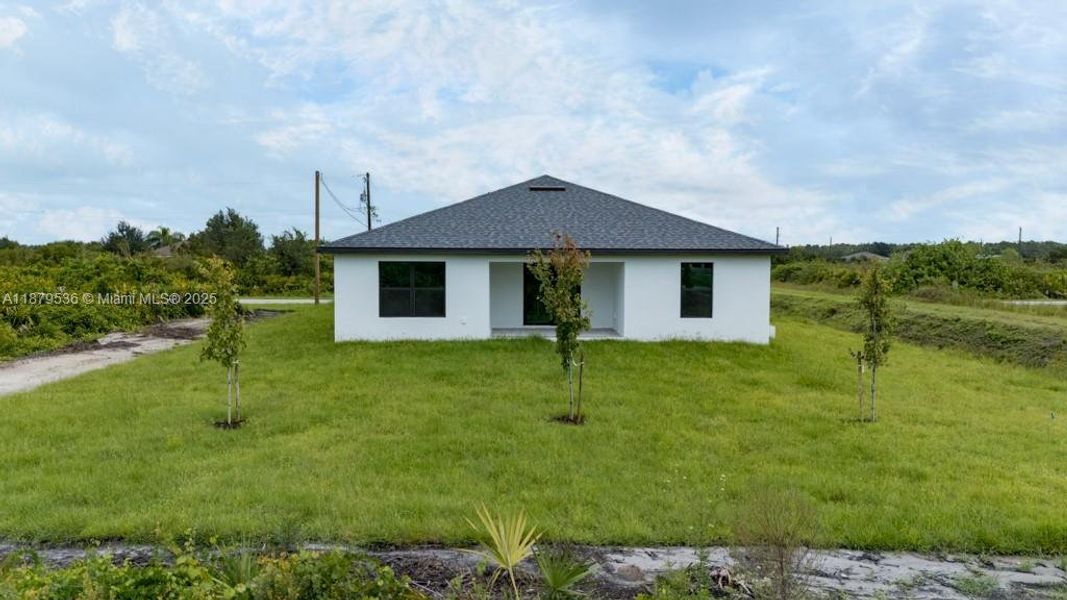 Front exterior of a new home in , Lehigh Acres, FL, highlighting curb appeal (Image 1). Front exterior of a new home in , Lehigh Acres, FL, highlighting curb appeal (Image 1).