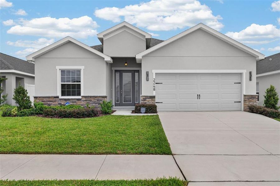 Front exterior of a new home in , Davenport, FL, highlighting curb appeal (Image 28).
