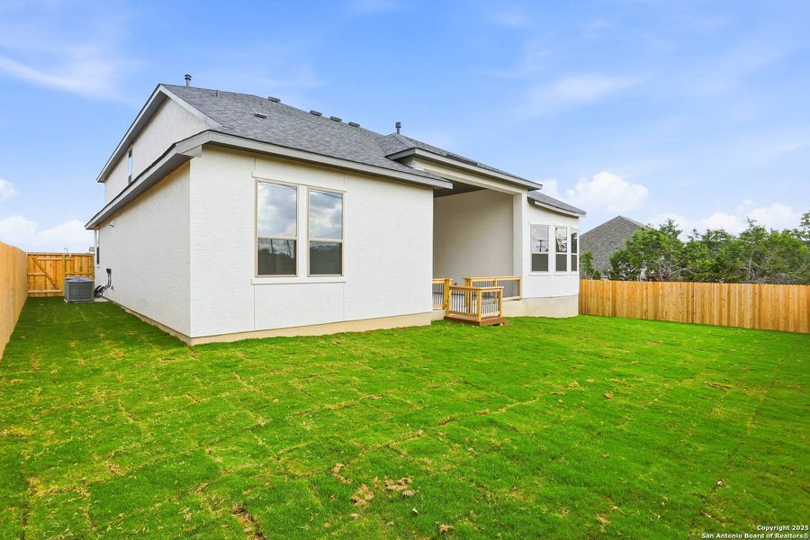Exterior details and patio area of a home in Kinder Ranch 70's, San Antonio (Image 34).