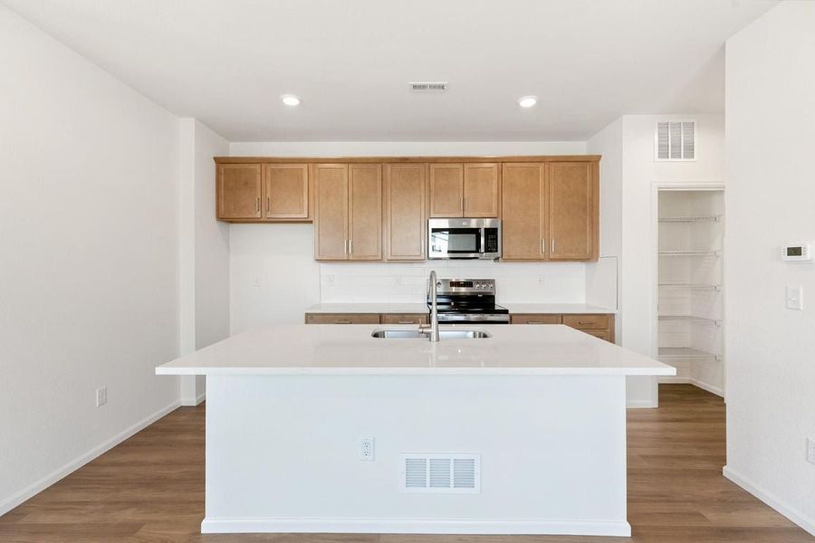 Furnished interior view inside a new home in Sky Ranch Villas, Watkins (Image 5).