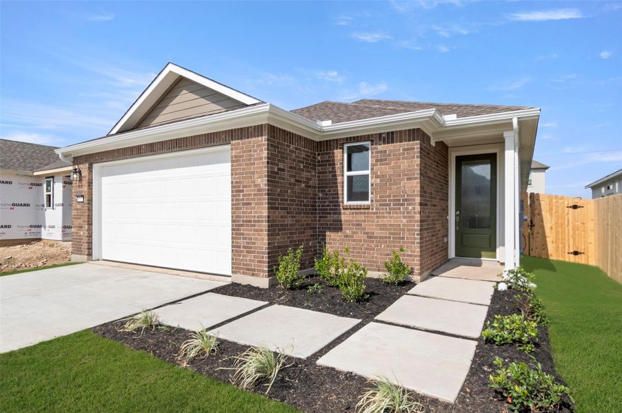 Front exterior of a new home in The Enclave at Hidden Oaks, Georgetown, TX, highlighting curb appeal (Image 22). Front exterior of a new home in The Enclave at Hidden Oaks, Georgetown, TX, highlighting curb appeal (Image 22).