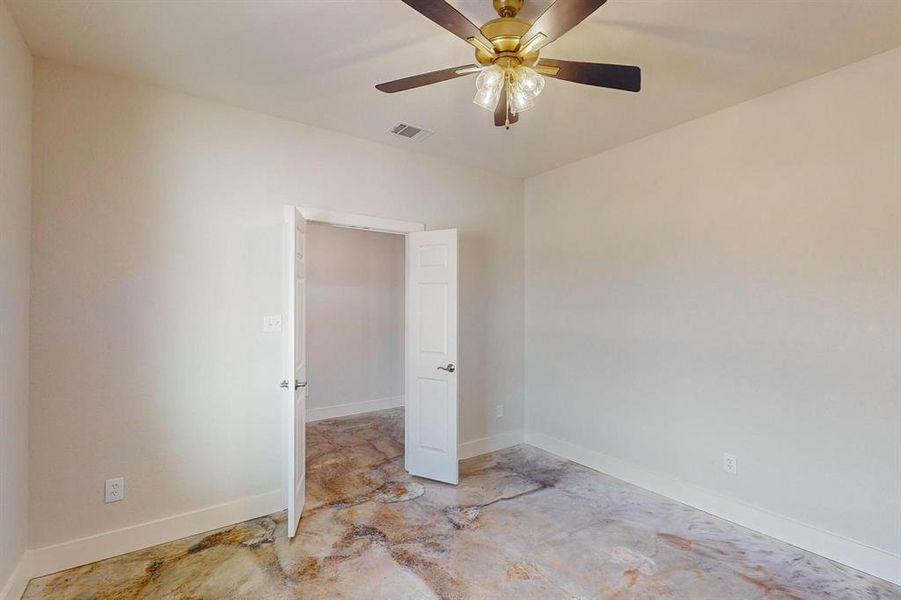 Unfurnished room featuring ceiling fan