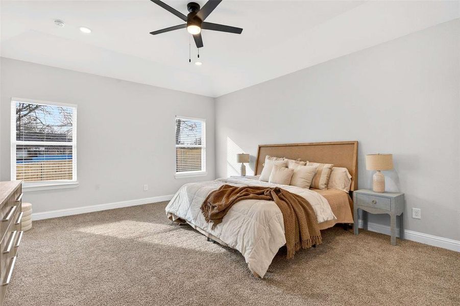 Bedroom with light carpet and ceiling fan