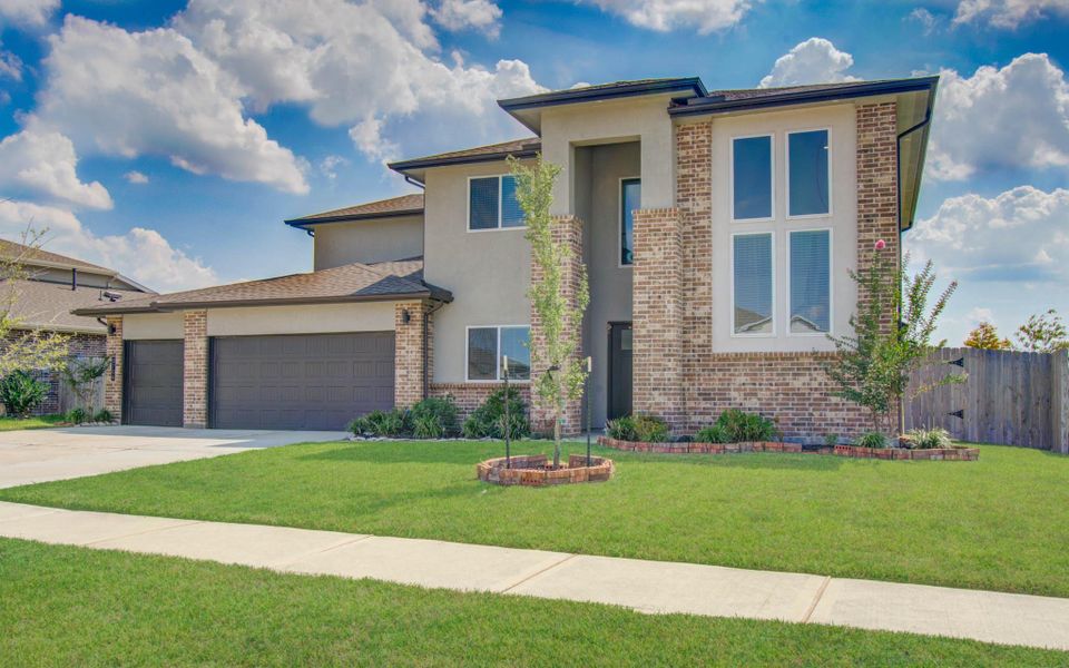 Front exterior of a new home in Parks Edge, Missouri City, TX, highlighting curb appeal (Image 20).
