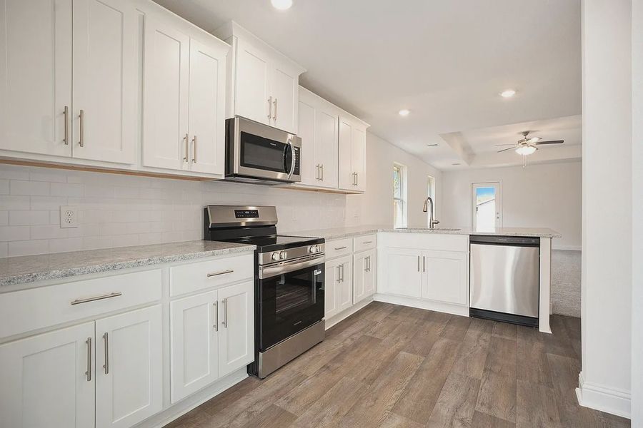 Furnished interior view inside a new home in Kiber Reserve, Angleton (Image 4).