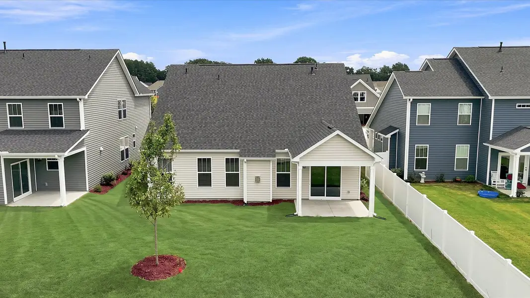 Warm and inviting outdoor living space with a covered rear porch and tasteful finishes at Walnut Ridge