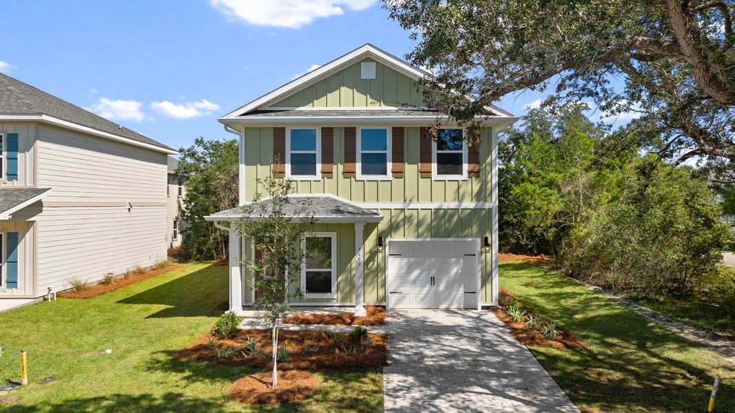 Front exterior of a new home in Sanctuary Beach, Panama City Beach, FL, highlighting curb appeal (Image 2).