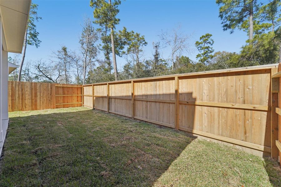 Exterior details and patio area of a home in Pinewood Trails - City Series, Atascocita (Image 3).