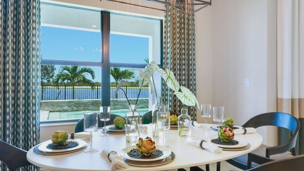 Representative furnished interior of a home built from the Meadow Brook by Neal Communities in SkySail, Naples (Image 12).