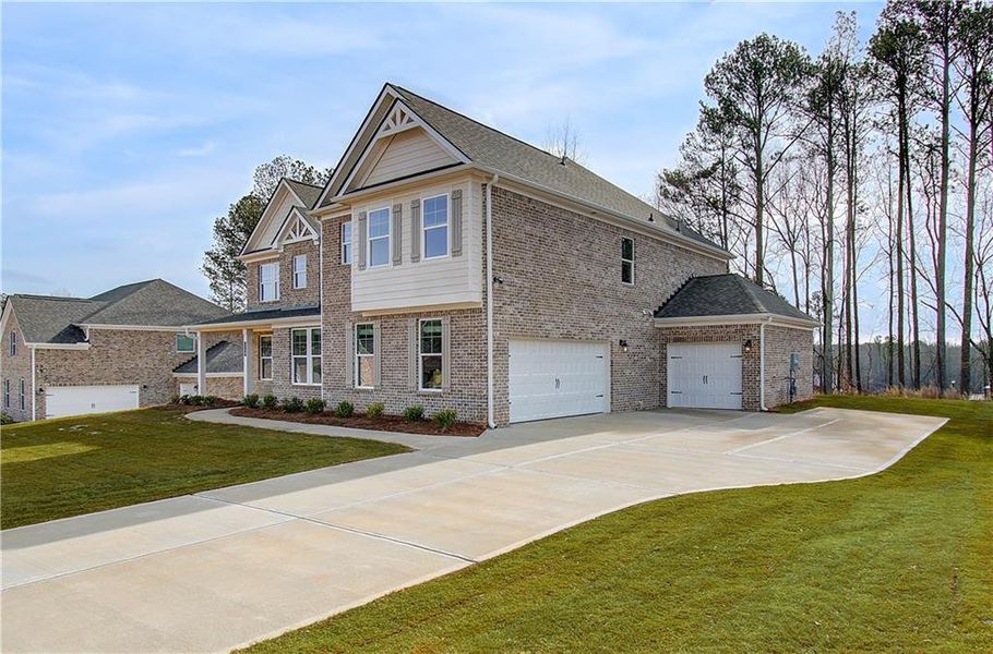 Front exterior of a new home in Trinity Park, McDonough, GA, highlighting curb appeal (Image 17).