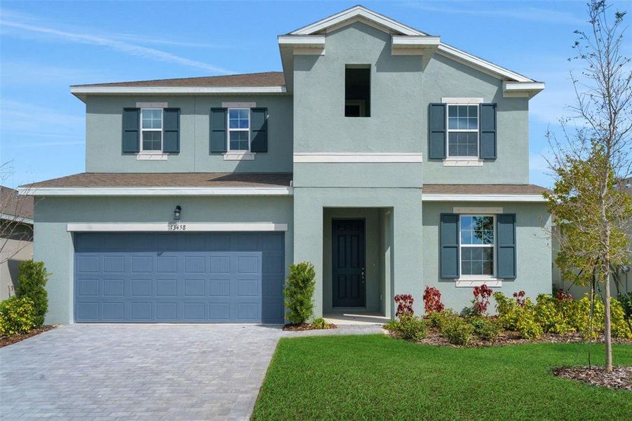 Front exterior of a new home in Turnleaf, Punta Gorda, FL, highlighting curb appeal (Image 2). Front exterior of a new home in Turnleaf, Punta Gorda, FL, highlighting curb appeal (Image 2).