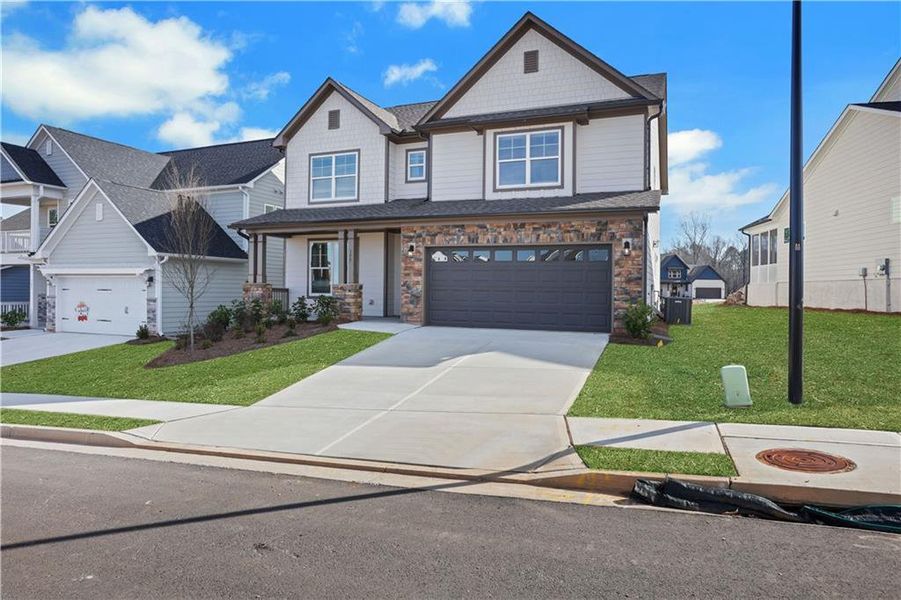 Front exterior of a new home in Twin Lakes, Hoschton, GA, highlighting curb appeal (Image 28).