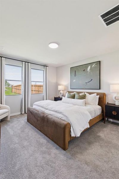 Primary Suite in the Magnolia home plan by Trophy Signature Homes – REPRESENTATIVE PHOTO