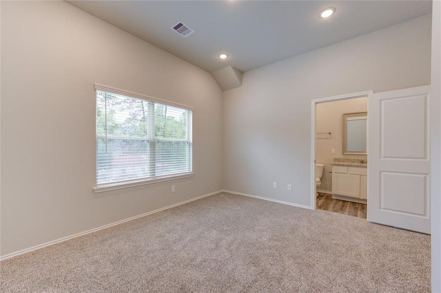 Master bedroom is roomy & flooded with natural light