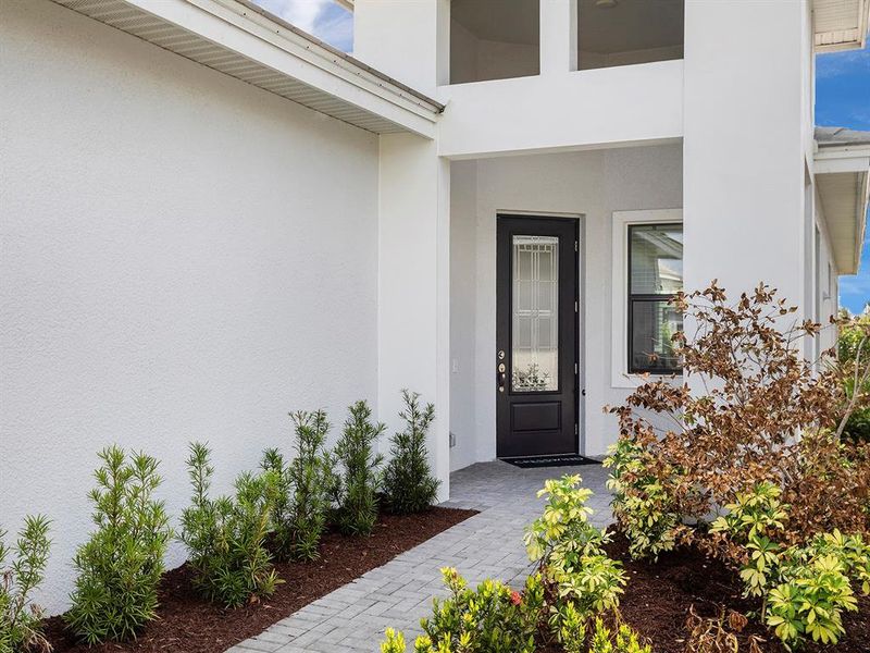 Front exterior of a new home in , Bradenton, FL, highlighting curb appeal (Image 1).