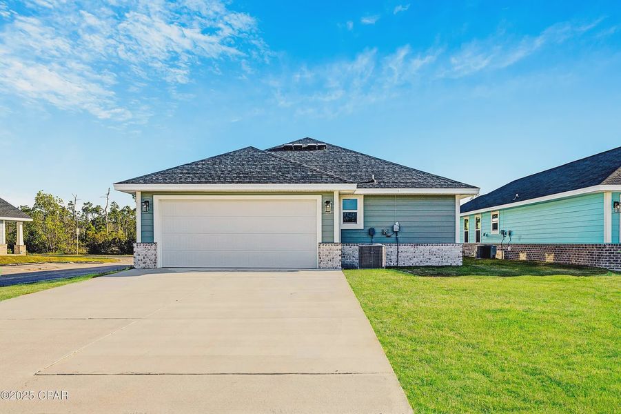 Front exterior of a new home in East Bay, Panama City, FL, highlighting curb appeal (Image 16).