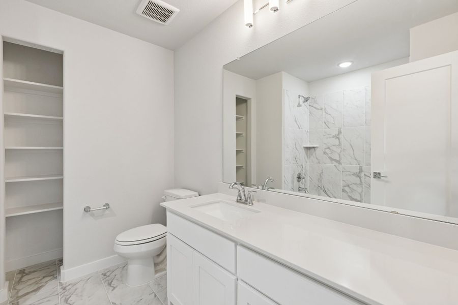 Bathroom in the Stanley II home plan by Trophy Signature Homes – REPRESENTATIVE PHOTO