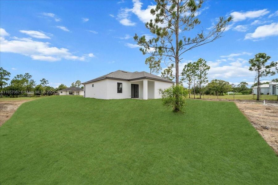 Front exterior of a new home in , Labelle, FL, highlighting curb appeal (Image 17). Front exterior of a new home in , Labelle, FL, highlighting curb appeal (Image 17).