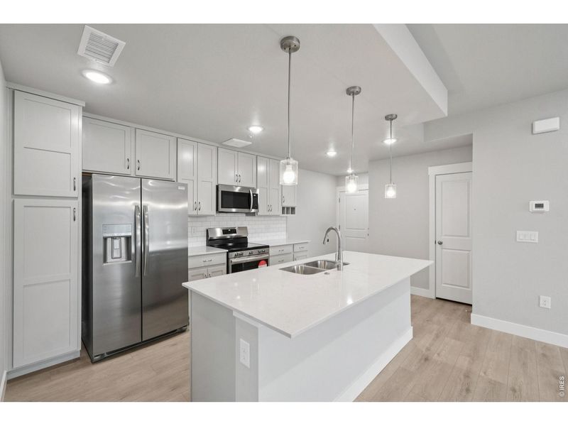 Furnished interior view inside a new home in Highlands at Fox Hill - The Flats, Longmont (Image 3).
