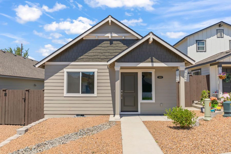 Front exterior of a new home in Feather Ridge, Redmond, OR, highlighting curb appeal (Image 27).