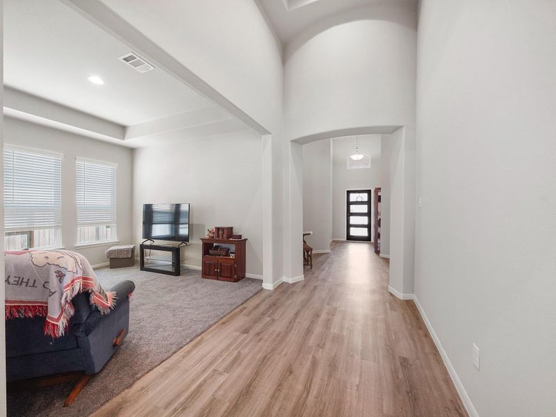 Front entrance hallway leading to a secondary living space Front entrance hallway leading to a secondary living space