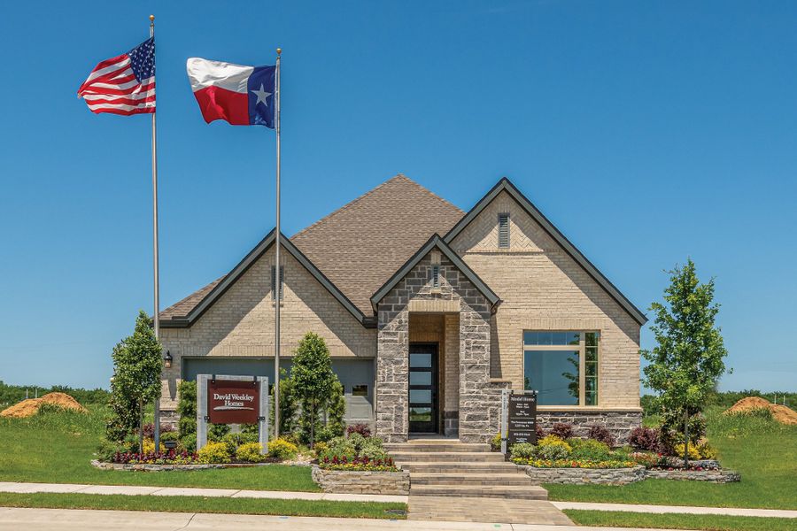 Front exterior of a new home in Mantua Point Classics, Van Alstyne, TX, highlighting curb appeal (Image 2). Front exterior of a new home in Mantua Point Classics, Van Alstyne, TX, highlighting curb appeal (Image 2).