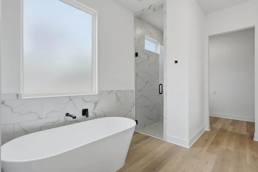 Luxury stand alone tub, and walk in shower.