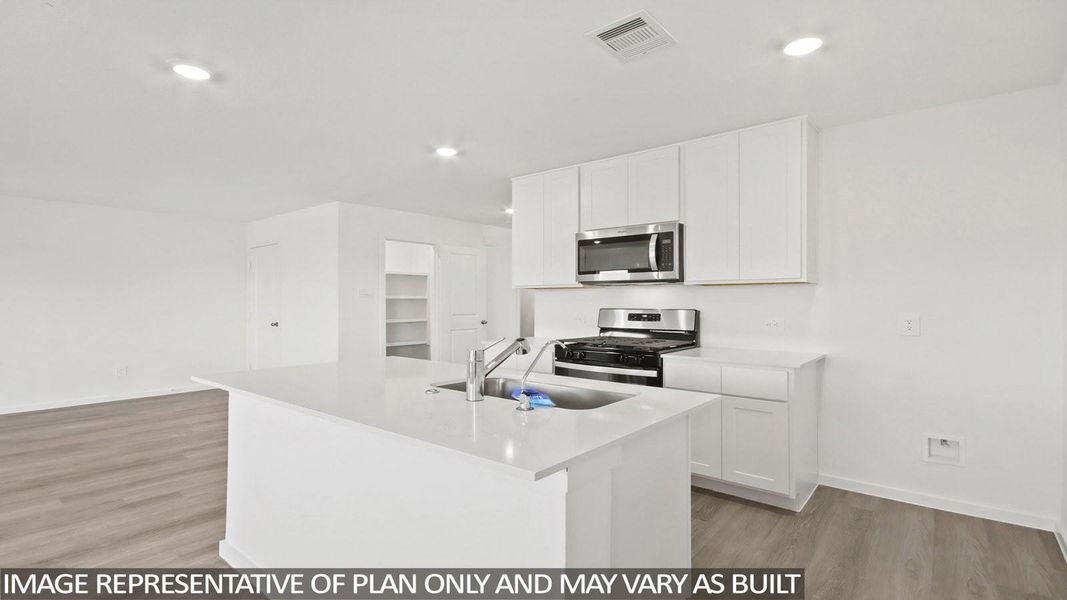 Furnished interior view inside a new home in Sunterra, Katy (Image 5).