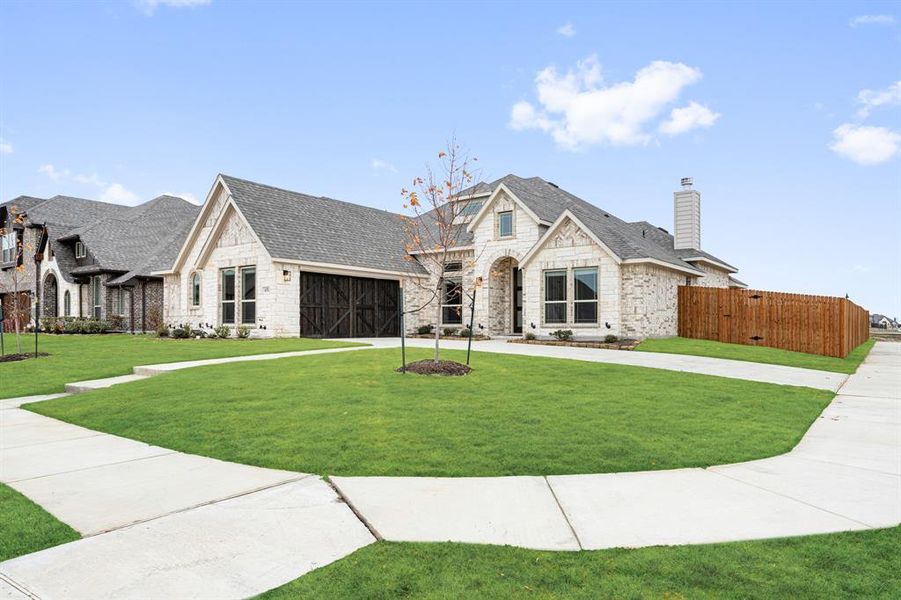 Front exterior of a new home in Sunrise at Garden Valley, Waxahachie, TX, highlighting curb appeal (Image 19).