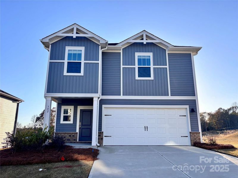 Front exterior of a new home in Seattle Crossing, Shelby, NC, highlighting curb appeal (Image 1). Front exterior of a new home in Seattle Crossing, Shelby, NC, highlighting curb appeal (Image 1).