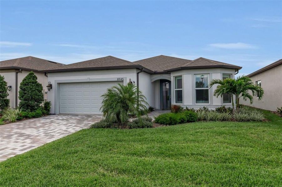 Front exterior of a new home in , Parrish, FL, highlighting curb appeal (Image 27).