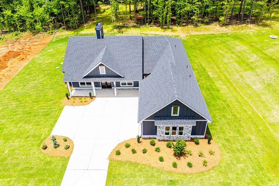 Front exterior of a new home in WOODMONT RESERVE, Roopville, GA, highlighting curb appeal (Image 33).