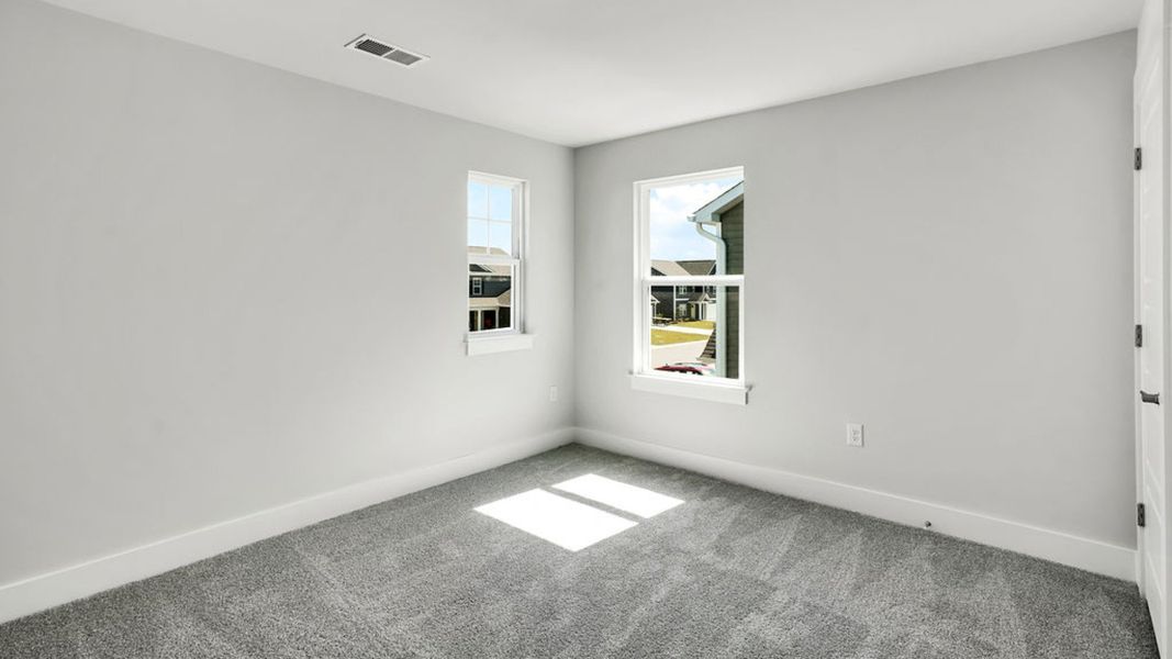 Spacious, unfurnished interior of a new home in Sidbury Station, Castle Hayne (Image 37).