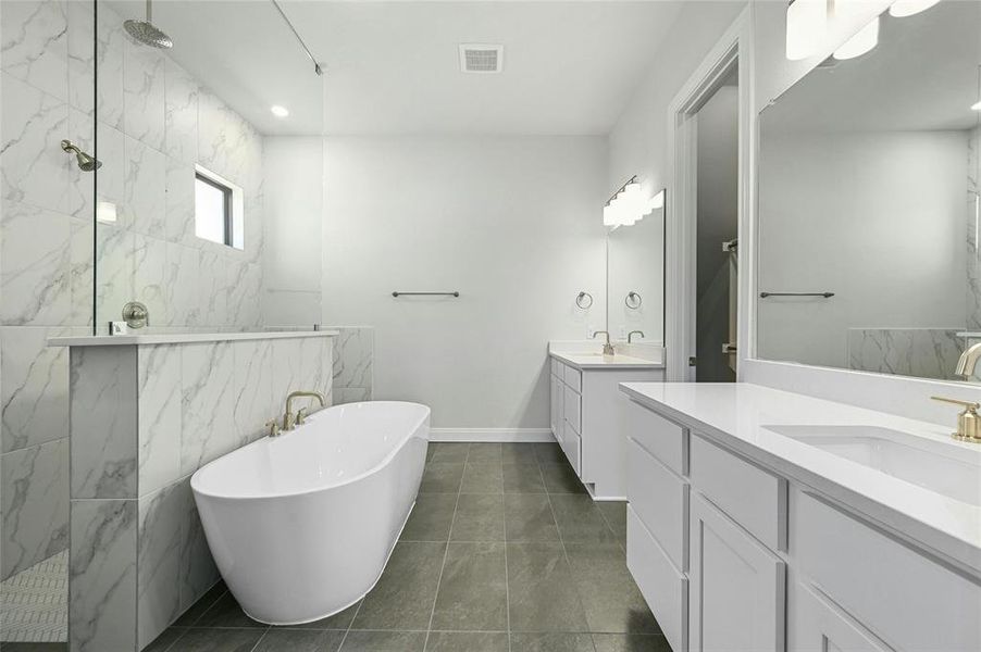 Master luxury bath room with a stand alone Tub and walk-in shower with rain head and regular shower head.