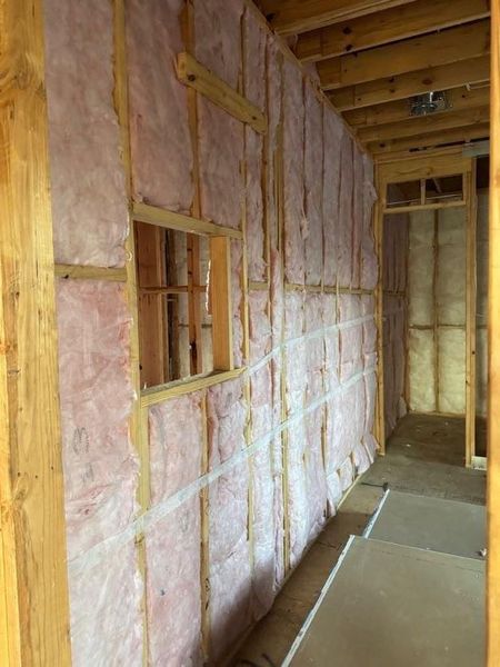 Sound wall insulation installed around secondary bedroom.