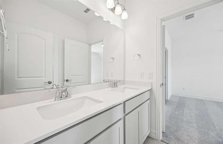 Spacious secondary bathroom with double sinks Spacious secondary bathroom with double sinks