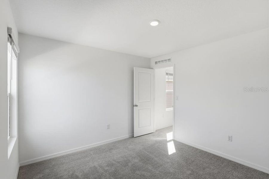 Spacious, unfurnished interior of a new home in Waterstone, Groveland (Image 24).