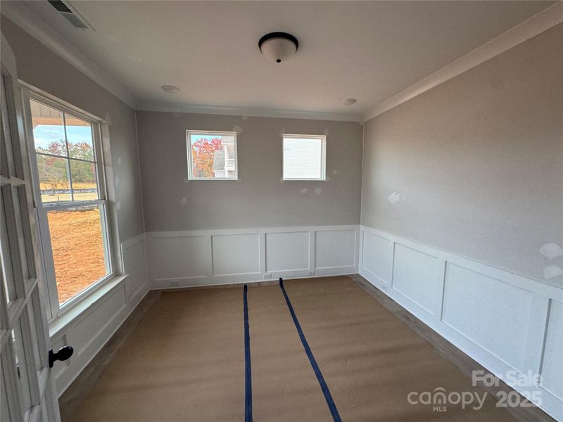 Office with French doors and wainscoting
