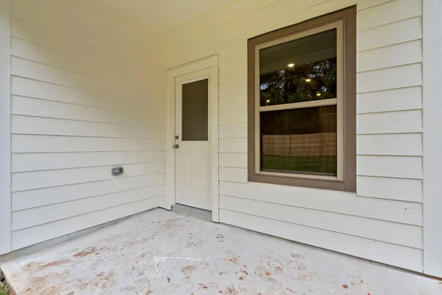 Exterior details and patio area of a home in Westridge Cove 50', Conroe (Image 3).