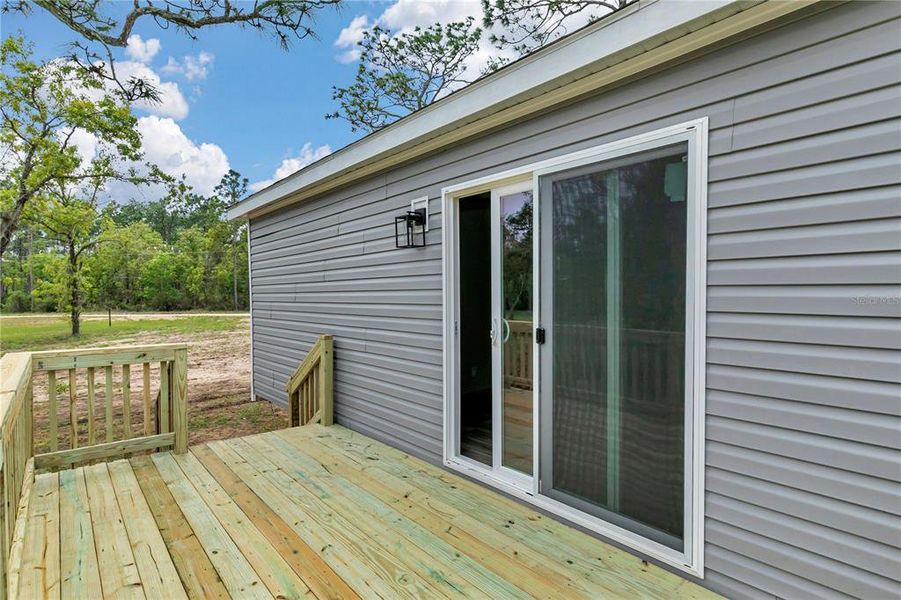Exterior details and patio area of a home in , Williston (Image 30).