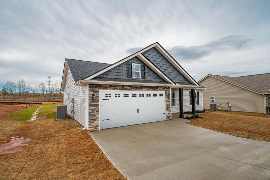 Representative exterior photo of a completed home built from the Saxon by Enchanted Homes in Guadalupe Heights, Seguin, TX (Image 26).