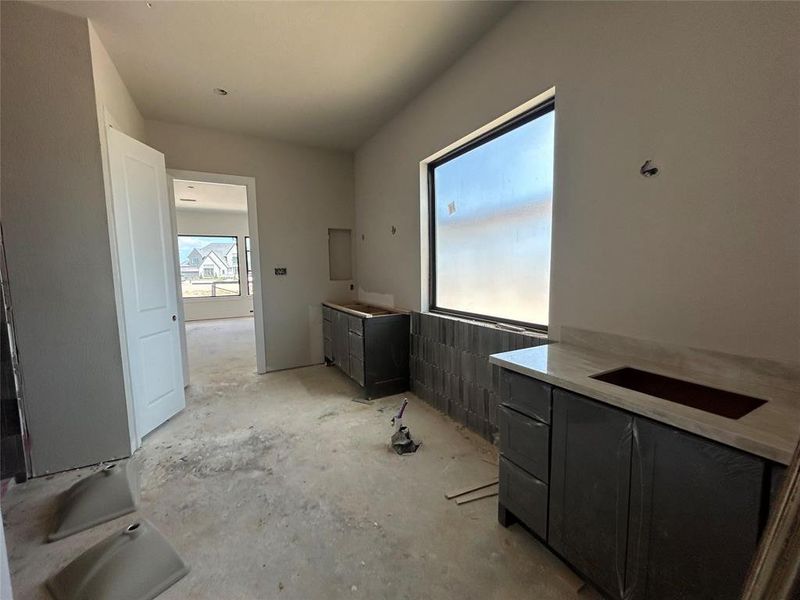 The main bathroom features a luxurious freestanding tub, perfect for a relaxing soak, alongside a spacious walk-in shower for a refreshing experience. This combination enhances both comfort and functionality, providing elegant options for your bathing routine.