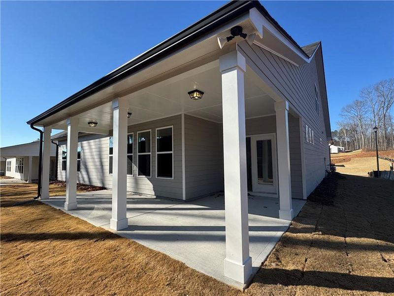 Exterior details and patio area of a home in Rosewood Lake Preserve, Hoschton (Image 18).