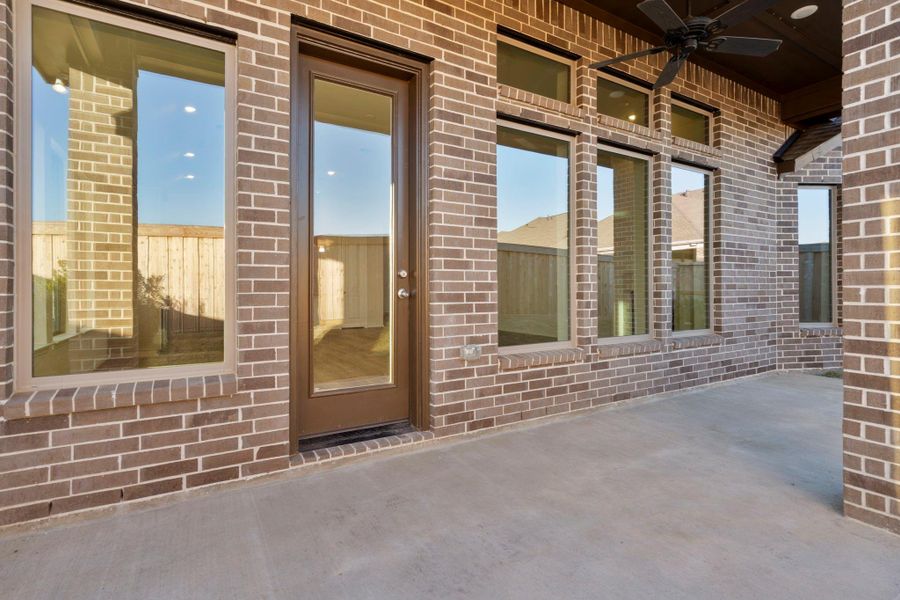 Exterior details and patio area of a home in Dunham Pointe, Cypress (Image 3).